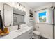 Stylish bathroom featuring modern vanity, mirror, and a walk-in shower with a sleek design at 416 Graham Dr, Clearwater, FL 33765