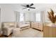 Cozy Bedroom with a crib, comfortable chair, and soft lighting for a peaceful atmosphere at 416 Graham Dr, Clearwater, FL 33765