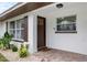 Close up of charming front entry with brick pavers, fresh landscaping at 416 Graham Dr, Clearwater, FL 33765
