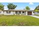 Charming single-story home with a well-manicured lawn and updated exterior at 416 Graham Dr, Clearwater, FL 33765