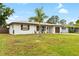 Well-maintained single-story home with a green lawn and inviting curb appeal at 416 Graham Dr, Clearwater, FL 33765