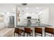 Modern kitchen boasts stainless steel appliances, granite countertops, and stylish breakfast bar seating at 416 Graham Dr, Clearwater, FL 33765