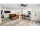 Bright open-concept living room boasts updated flooring, and modern finishes at 416 Graham Dr, Clearwater, FL 33765