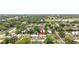 Aerial view showcases the home's location within a lush, green neighborhood, close to amenities and community features at 416 Graham Dr, Clearwater, FL 33765