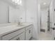 Bright bathroom featuring marble tile floors, modern vanity and neutral paint at 4423 Pond Brook Ct, Bradenton, FL 34211