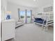 Shared bedroom with a bunk bed, a living area and great natural light at 4423 Pond Brook Ct, Bradenton, FL 34211