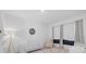 Bright Bedroom features a crib, modern chair and changing table, offering a calming space at 4423 Pond Brook Ct, Bradenton, FL 34211