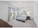 Bedroom with a bed, dark wood dresser, and ample natural light at 4423 Pond Brook Ct, Bradenton, FL 34211