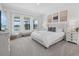 Bright bedroom featuring a serene lake view, cozy gray bedding, and stylish decor at 4423 Pond Brook Ct, Bradenton, FL 34211
