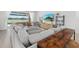 Spacious living room offers a lake view, comfortable seating, and stylish decor at 4423 Pond Brook Ct, Bradenton, FL 34211
