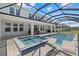 Relaxing screened pool with a spa and an extended covered patio ideal for entertainment and leisure at 4423 Pond Brook Ct, Bradenton, FL 34211