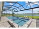 Enclosed pool and spa area with lake view and lounge chairs, perfect for relaxation and outdoor enjoyment at 4423 Pond Brook Ct, Bradenton, FL 34211