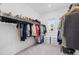 Spacious walk-in closet with organized storage solutions and natural light at 4423 Pond Brook Ct, Bradenton, FL 34211