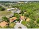 Aerial view of homes in a leafy neighborhood with mature trees and cul-de-sac at 5108 26Th Street W Ct, Bradenton, FL 34207