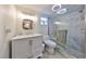 Modern bathroom features walk-in shower with glass door, updated vanity, and contemporary lighting at 5108 26Th Street W Ct, Bradenton, FL 34207