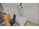 Cozy bedroom features wood-look flooring, ceiling fan, and bright natural light at 5108 26Th Street W Ct, Bradenton, FL 34207