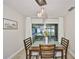 Dining area features table with chairs and sliding glass doors overlooking outdoor seating at 5108 26Th Street W Ct, Bradenton, FL 34207