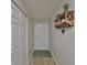 Bright entryway featuring a white door, wood-look floors, and a decorative shelf at 5108 26Th Street W Ct, Bradenton, FL 34207