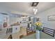 View of the bright kitchen with butcher block island and stainless steel appliances, with an adjacent dining area at 5108 26Th Street W Ct, Bradenton, FL 34207
