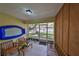 Enclosed porch with tile floor and wood paneling provides outdoor living space at 5108 26Th Street W Ct, Bradenton, FL 34207