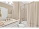 Bright bathroom featuring a bathtub with a shower and a vanity with a white cabinet and light countertop at 5128 Dockyard Pl, Land O Lakes, FL 34638