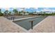 Outdoor bocce ball courts featuring multiple lanes, well-maintained surfaces, and covered seating areas for players at 5128 Dockyard Pl, Land O Lakes, FL 34638