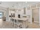 Open kitchen with quartz countertops, stainless steel appliances, and a large island with seating at 5128 Dockyard Pl, Land O Lakes, FL 34638