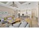Open-concept living space featuring a modern kitchen and comfortable living room at 5128 Dockyard Pl, Land O Lakes, FL 34638