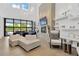 Relaxing lounge area with high ceilings, decorative lighting fixtures, and luxurious seating at 5128 Dockyard Pl, Land O Lakes, FL 34638