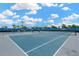 Outdoor pickleball courts with shade canopies, net systems, and fencing, providing a recreational space for residents at 5128 Dockyard Pl, Land O Lakes, FL 34638