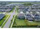 Aerial view of a home in a well-maintained neighborhood near a lake at 5601 Limelight Dr, Apollo Beach, FL 33572