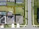 Aerial view of a home with a large, well-manicured backyard and solar panels at 5601 Limelight Dr, Apollo Beach, FL 33572