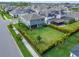 Aerial view of a home with a large, well-manicured backyard and patio at 5601 Limelight Dr, Apollo Beach, FL 33572