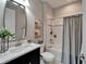 Cozy bathroom features a shower and tub combination, decorative mirror, and neutral decor at 5601 Limelight Dr, Apollo Beach, FL 33572
