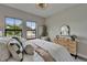Bedroom featuring light colored walls, contemporary decor, and plenty of natural light at 5601 Limelight Dr, Apollo Beach, FL 33572