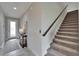 Inviting entryway with tile flooring, a staircase, decor, and a well-lit front door at 5601 Limelight Dr, Apollo Beach, FL 33572