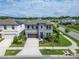 Gray two-story home with well-manicured landscaping and sidewalks at 5601 Limelight Dr, Apollo Beach, FL 33572