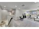 Spacious loft area with carpet, comfortable seating, a television, and lots of natural light at 5601 Limelight Dr, Apollo Beach, FL 33572