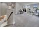 Spacious carpeted loft with comfortable seating area bathed in natural light at 5601 Limelight Dr, Apollo Beach, FL 33572