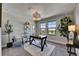 Bright home office with large windows, comfortable seating, and stylish decor at 5601 Limelight Dr, Apollo Beach, FL 33572