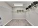 Spacious walk-in closet with ample shelving and carpeting, ready for organized storage at 5601 Limelight Dr, Apollo Beach, FL 33572