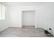 A bright bedroom with modern flooring and a closet offering ample storage at 6507 Spring Oak Ct, Tampa, FL 33625
