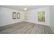 Bright bedroom with modern flooring, a ceiling fan, and natural light from a window at 6507 Spring Oak Ct, Tampa, FL 33625