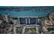 Stunning aerial view of a modern high-rise building, with coastal views and covered parking at 7050 Sunset S Dr # 912, South Pasadena, FL 33707