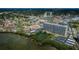 Beautiful aerial view of a waterfront condo community featuring a pool, tennis court and convenient parking at 7050 Sunset S Dr # 912, South Pasadena, FL 33707
