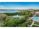 Beautiful aerial view of the pool, waterfront, and lush landscaping with trees and waterways at 7050 Sunset S Dr # 912, South Pasadena, FL 33707
