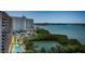 Scenic aerial view of a modern high-rise building with views of the bay at 7050 Sunset S Dr # 912, South Pasadena, FL 33707