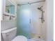 Bathroom with a modern sliding glass shower door, updated fixtures, and a clean, functional design at 7050 Sunset S Dr # 912, South Pasadena, FL 33707