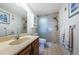 Well-maintained bathroom features a vanity, toilet, and a glass-enclosed shower at 7050 Sunset S Dr # 912, South Pasadena, FL 33707