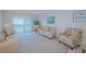 The living room has plenty of seating and water views to the balcony at 7050 Sunset S Dr # 912, South Pasadena, FL 33707